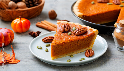 Obraz na płótnie Festive Homemade Pumpkin Pie decorated with pecan nuts and pumpkin seeds