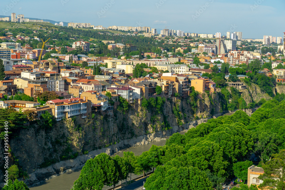 Beautiful view of the houses on the edge of the cliff on the Kura river in Tbilisi