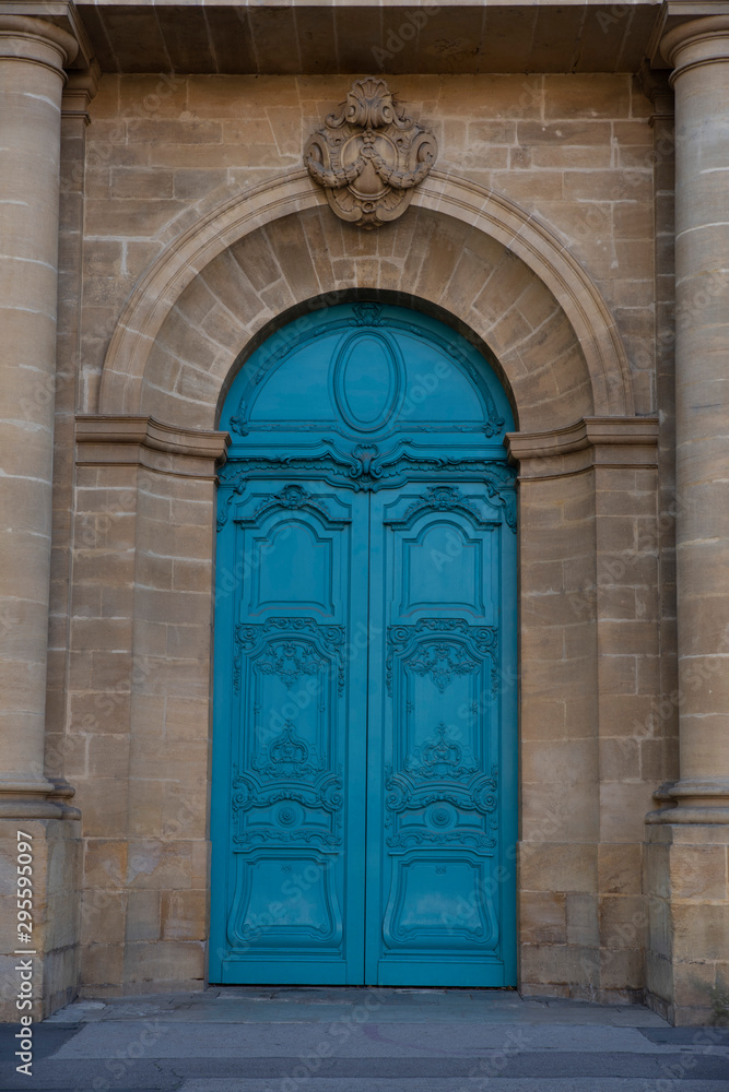 Blue door of an old building in the city of Metz in France