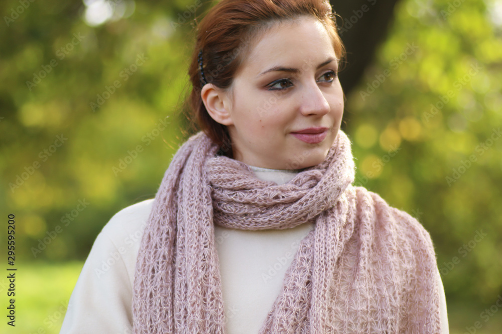 girl in a park wearing a scarf girl in a park wearing a scarf