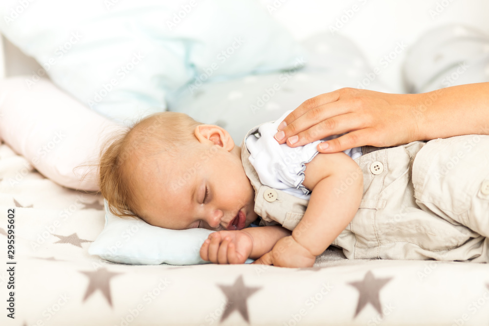 Portrait of a beautiful sleeping baby in the bed Portrait of a beautiful sleeping baby in the bed