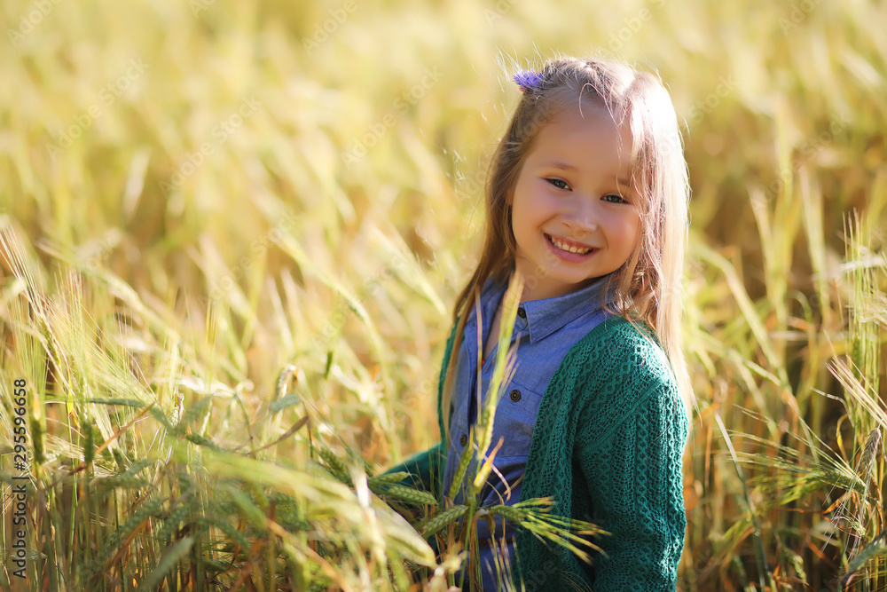 A young mother walk in wheat fields A young mother walk in wheat fields