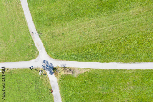 vertical topview of crossing paths crossway at green meadow
