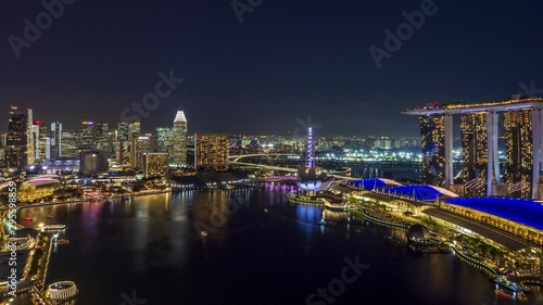 [Zoom out] Singapore skyscrapers from Dusk to Night time-lapse video