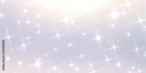 Bright stars sparkling on shiny blurred background. Winter holidai amazing decor. Bright clear texture. New year style.