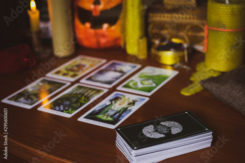  Mystical atmosphere, view of tarot card on the table, esoteric concept, fortune telling and predictions. 