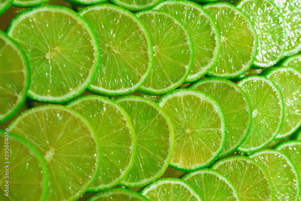 Fresh lime slices as a background. Fresh lime slices as a background.