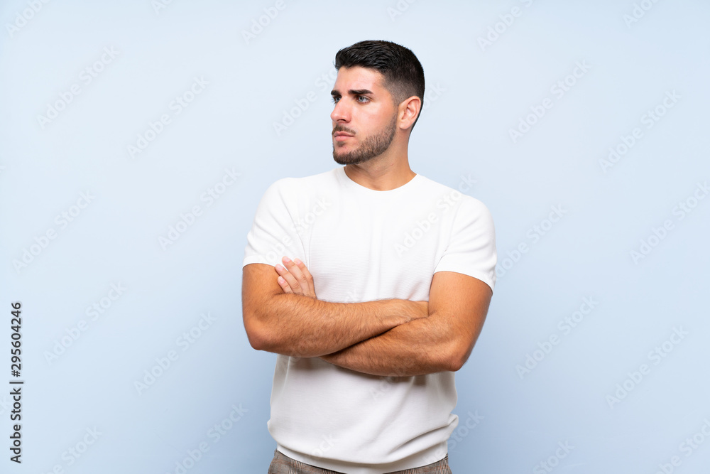 Caucasian handsome man over isolated blue background portrait Caucasian handsome man over isolated blue background portrait
