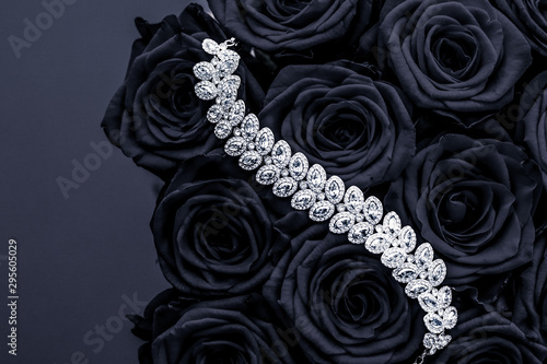 Luxury diamond jewelry bracelet and black roses flowers, love gift on Valentines Day and jewellery brand holiday background design