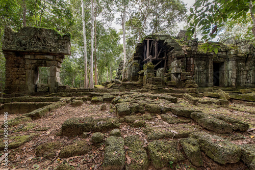 Lost in the forest the small Ta Nei temple attract a few visitors, Siem Reap, Cambodia photo