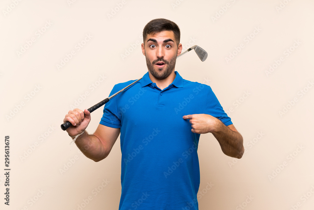 Young handsome golfer man over isolated background with surprise facial expression Young handsome golfer man over isolated background with surprise facial expression