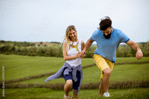 Lovinh couple running throu...