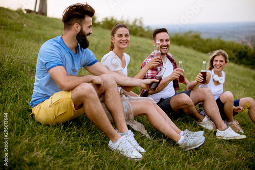 Group of young friends sitt...