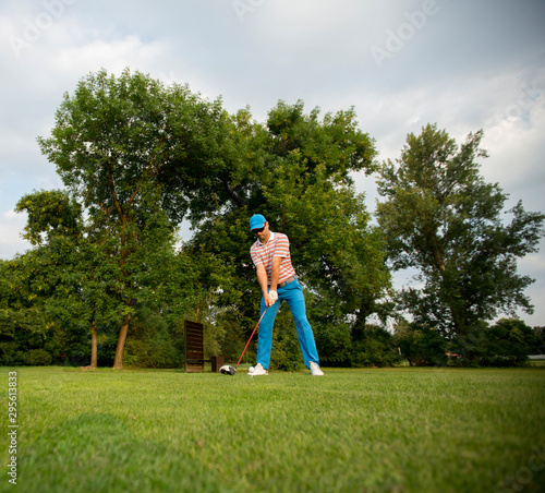 Young man playing golf