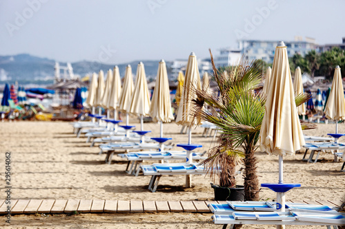 beach with umbrella and chairs on beach