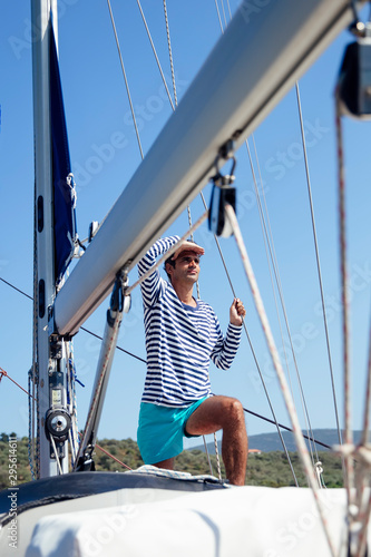 Young man on a sailboat