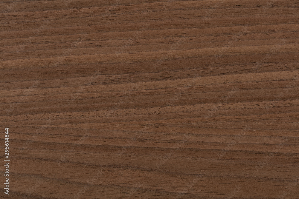 Natural stylish dark nut veneer background as part of your interior. High quality texture. Natural stylish dark nut veneer background as part of your interior. High quality texture.
