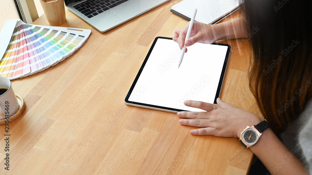 Graphic designer working on mockup laptop with empty screen, Top view working desk. Graphic designer working on mockup laptop with empty screen, Top view working desk.