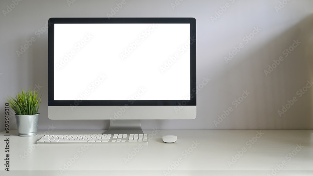 Simple workspace computer with plat pot and copy space office table. Simple workspace computer with plat pot and copy space office table.
