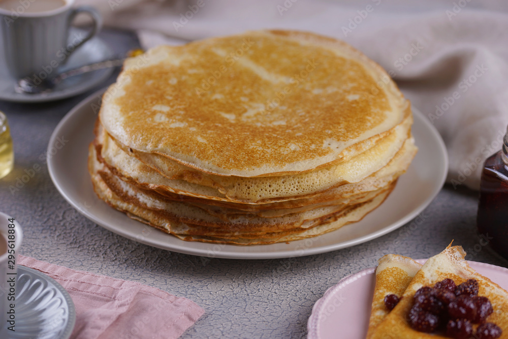 Breakfast with pancakes on a textured background Breakfast with pancakes on a textured background