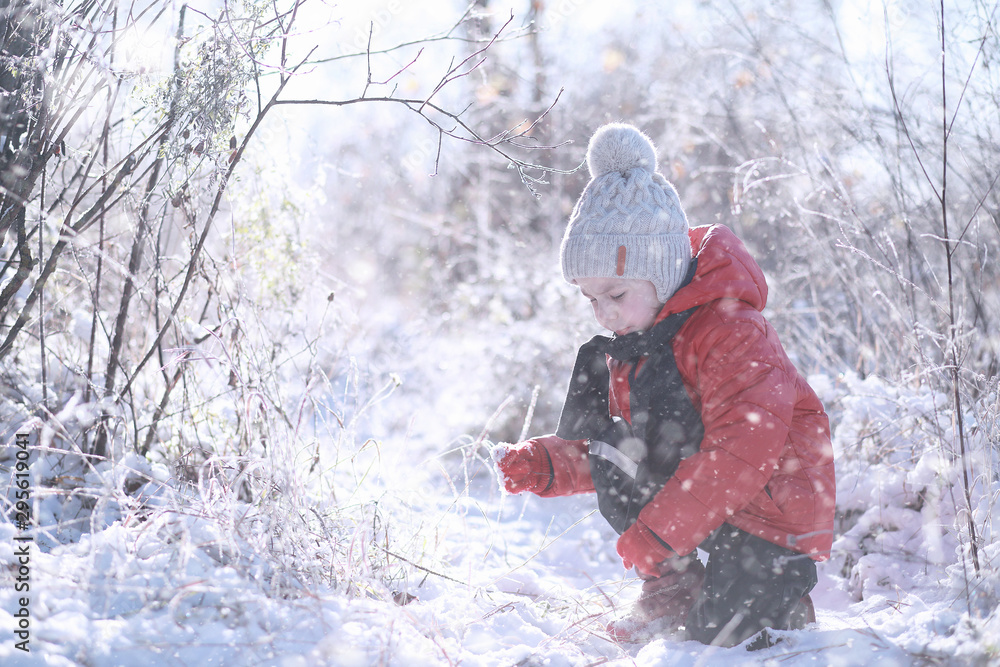 Kids walk in the park first snow