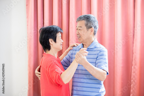 asian eldely couple dance together photo