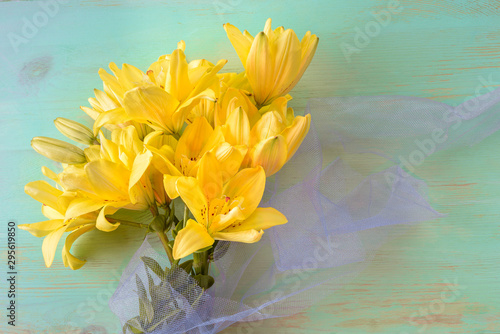 Close up of Lily flowers on the wooden background.