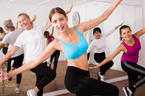 Cheerful different ages women learning swing steps at dance class