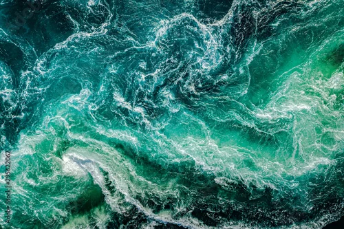 Panel kuchenny z motywem Waves of water of the river and the sea meet each other during high tide and low tide.