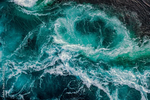 Panel kuchenny z motywem Waves of water of the river and the sea meet each other during high tide and low tide.