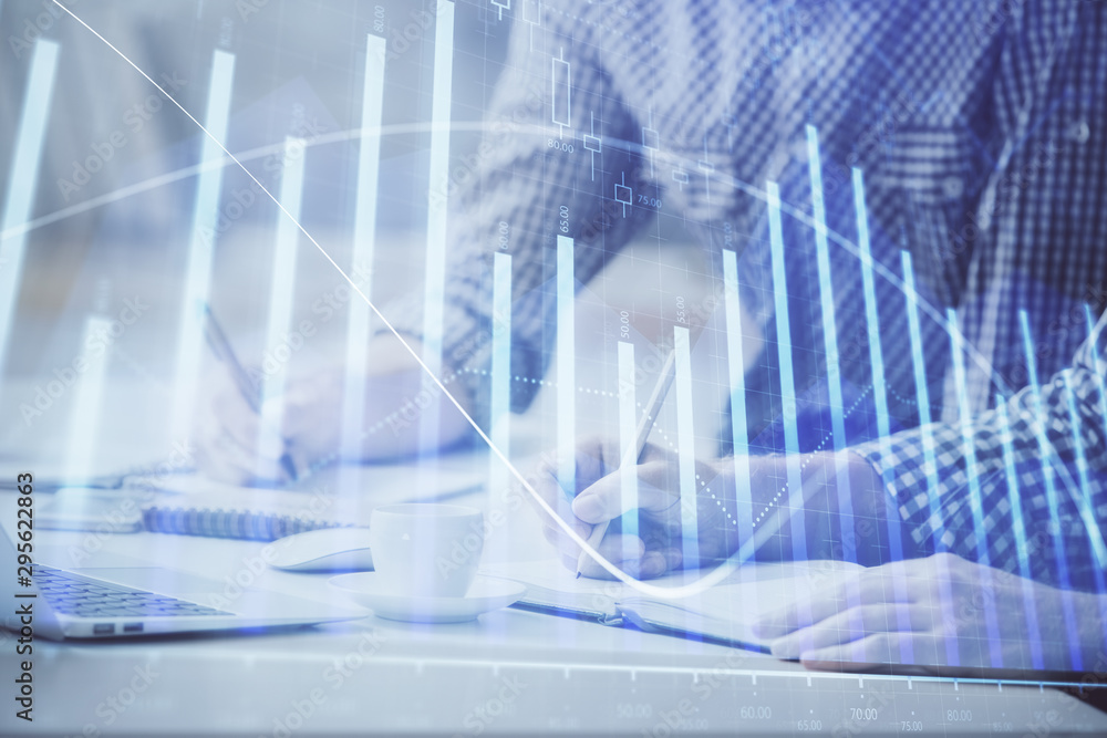 Multi exposure of forex chart with man working on computer on background. Concept of market analysis. Multi exposure of forex chart with man working on computer on background. Concept of market analysis.