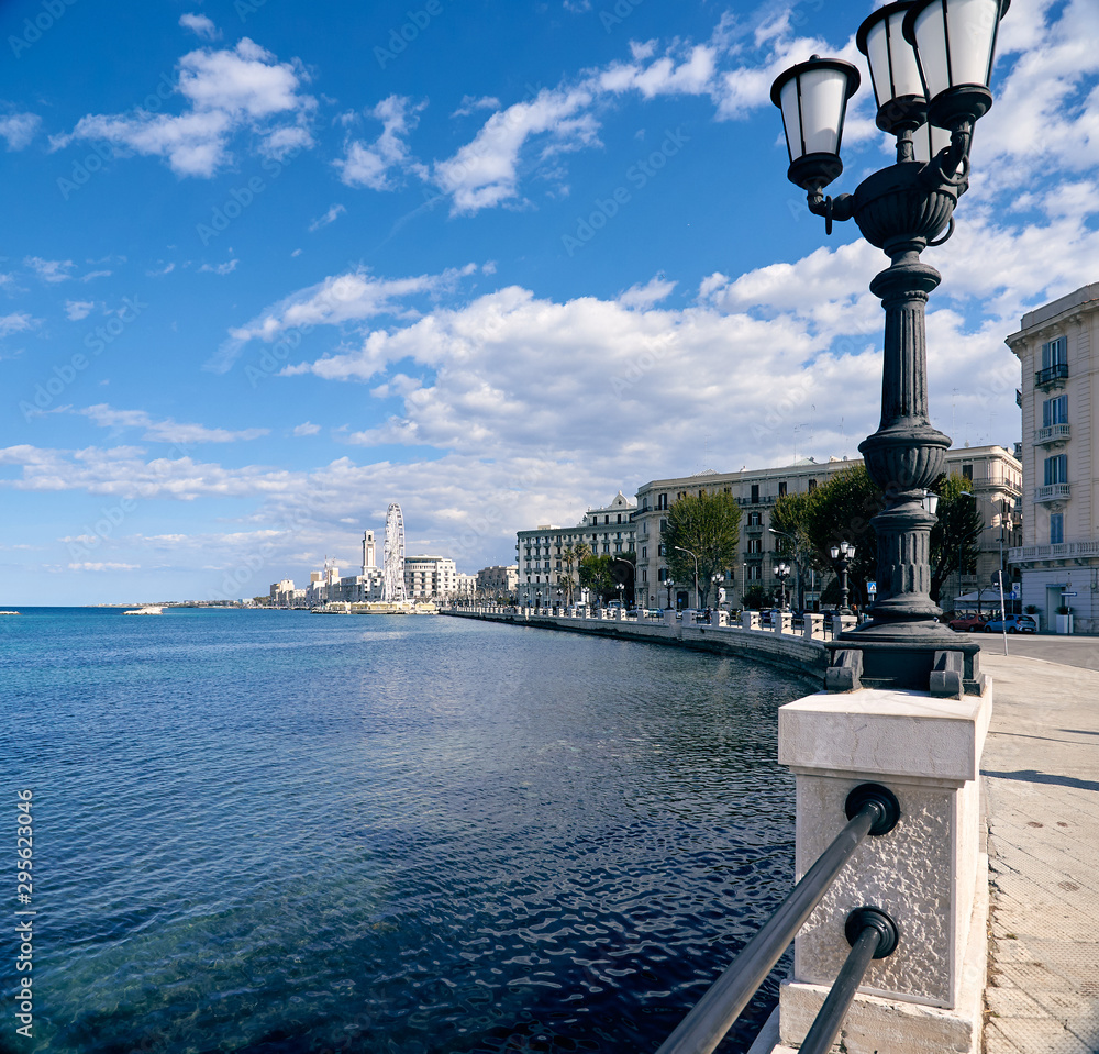 Panorama of the Italian city of Bari, promenade, lights, observation wheel, spring. Traveling in Italy, tourism
