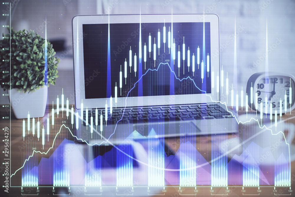 Forex market graph hologram and personal computer on background. Multi exposure. Concept of investment. Forex market graph hologram and personal computer on background. Multi exposure. Concept of investment.
