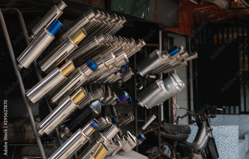 New and used motorcycle exhaust chrome pipes in a motorcykles shop or