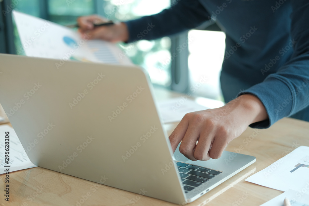 male freelancer working with computer document. startup man analyzing financial performance. student studying doing assignment male freelancer working with computer document. startup man analyzing financial performance. student studying doing assignment