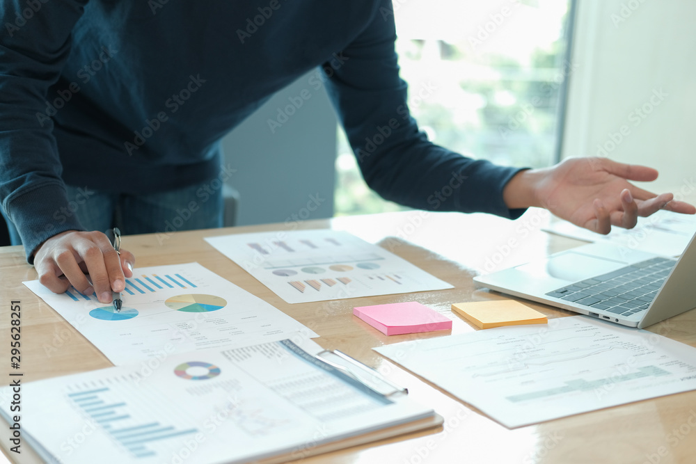 male freelancer working with computer document. startup man analyzing financial performance. student studying doing assignment male freelancer working with computer document. startup man analyzing financial performance. student studying doing assignment