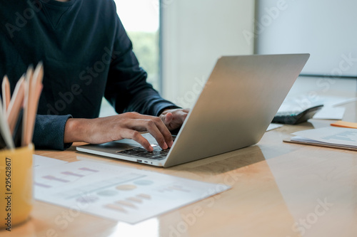 male freelancer working with computer document. startup man analyzing financial performance. student studying doing assignment