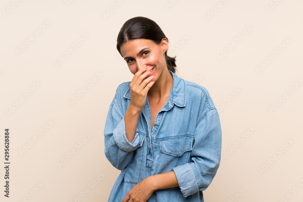 Young woman over isolated background smiling a lot Young woman over isolated background smiling a lot