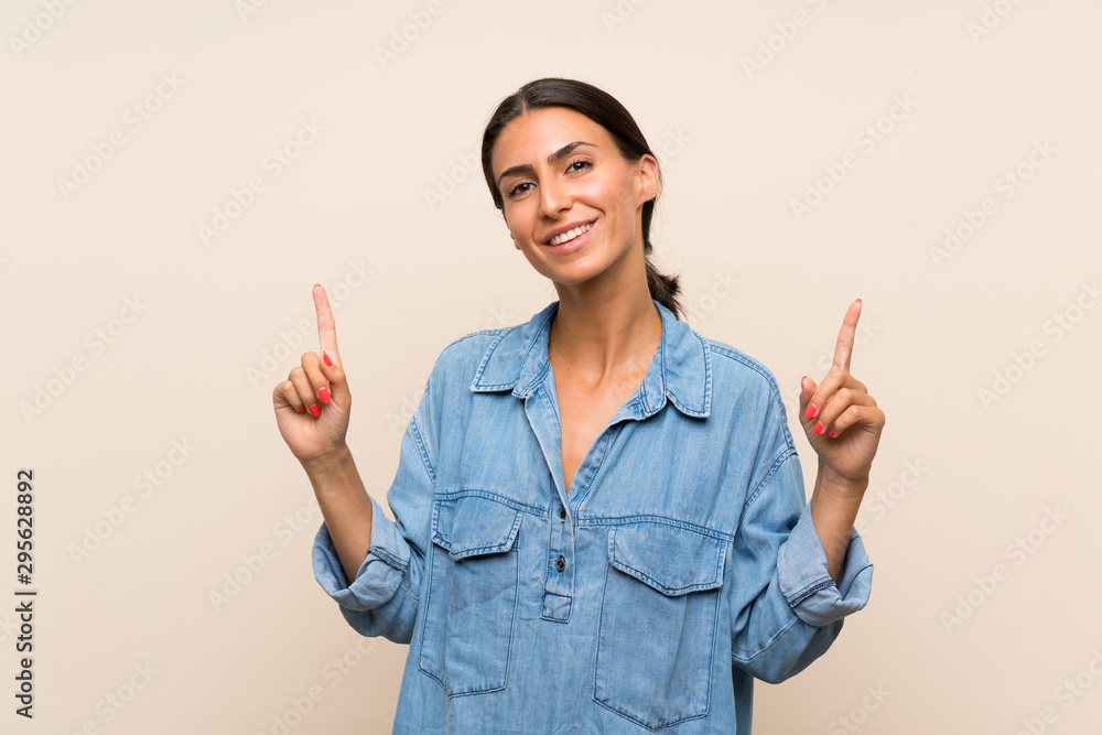 Young woman over isolated background pointing up a great idea Young woman over isolated background pointing up a great idea