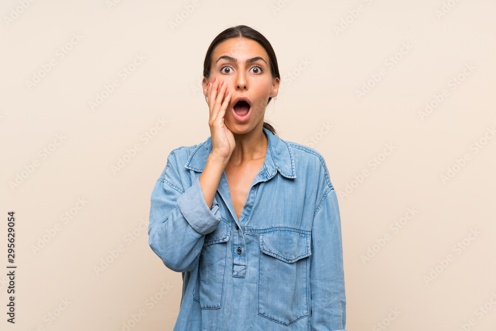 Young woman over isolated background with surprise and shocked facial expression Young woman over isolated background with surprise and shocked facial expression