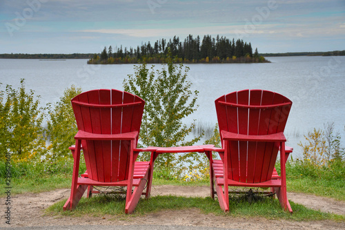 Peaceful tranquill nature with lonely pair of chairs during the summer in europe