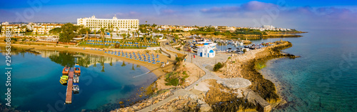 Panorama of Cyprus from a height. Mediterranean sea. Protaras. The Port Of Paralimni. Pernera. Top view of kalamies beach. Church of St. Nicholas in Cyprus. Beach resort. The Temple Of Agios Nikolaos photo