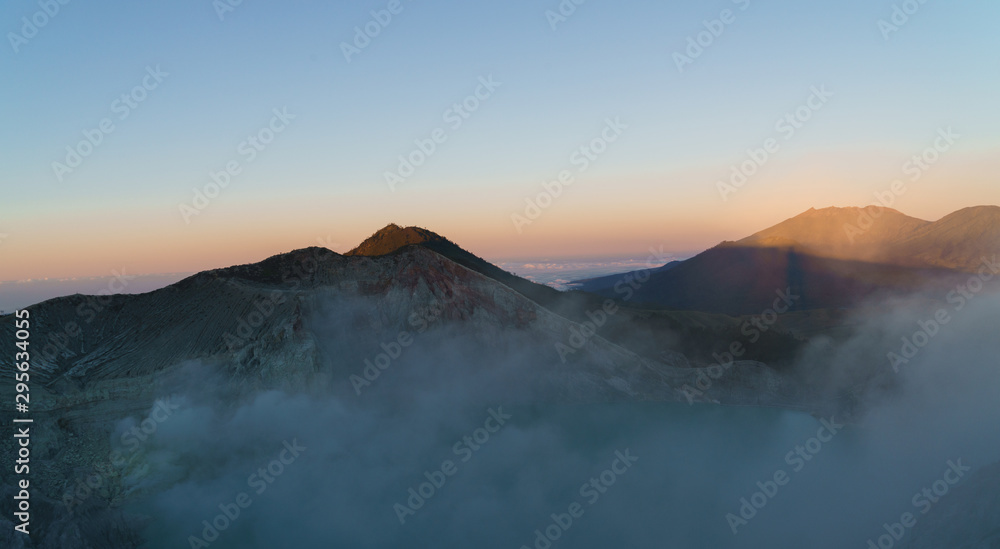 First light with fog. Sunrise on on the mountain  Ijen  Java ,Indonesia.