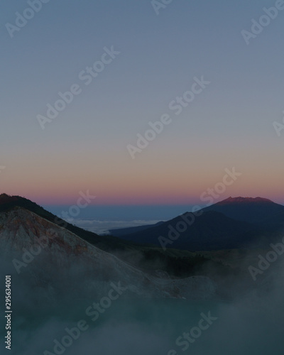 First light with fog. Sunrise on on the mountain Ijen Java ,Indonesia.