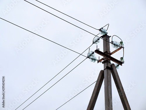A power line and white sky.