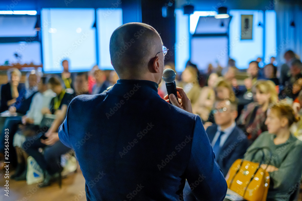 Male presenter speaks to audiences Male presenter speaks to audiences