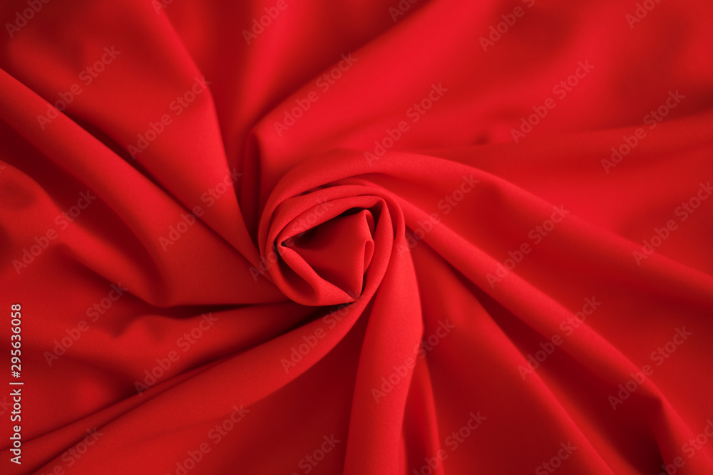 Red batiste made of cotton. sample of red soft fabric with pleats. Top view Red batiste made of cotton. sample of red soft fabric with pleats. Top view