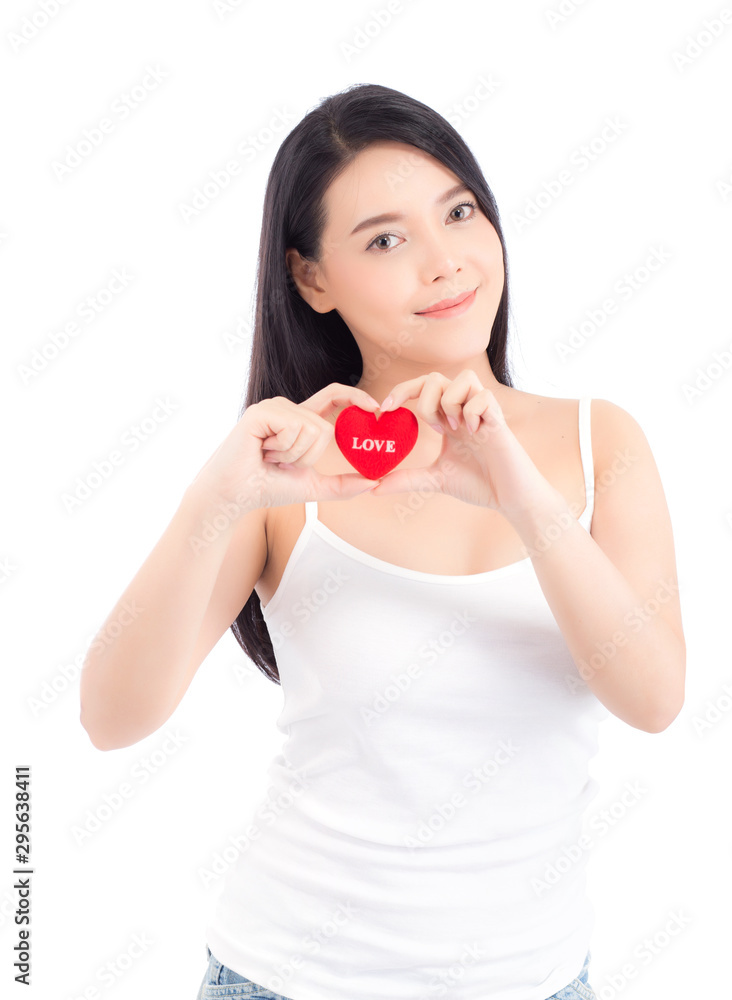 Portrait of beautiful asian young woman holding red heart shape pillow and smile isolated on white background, valentines day, holiday concept. Portrait of beautiful asian young woman holding red heart shape pillow and smile isolated on white background, valentines day, holiday concept.