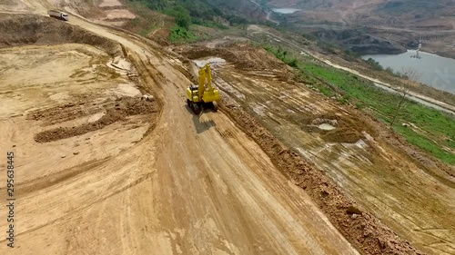 Concept of digging in some part of the soil in order to fill some soil in the area To be used to build a house