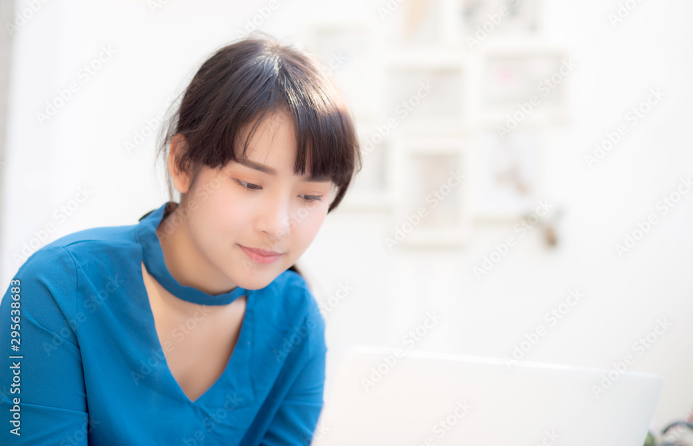 Beautiful portrait asia young woman working online on laptop sitting at cafe shop, professional female freelance using notebook computer, business and communication concept. Beautiful portrait asia young woman working online on laptop sitting at cafe shop, professional female freelance using notebook computer, business and communication concept.